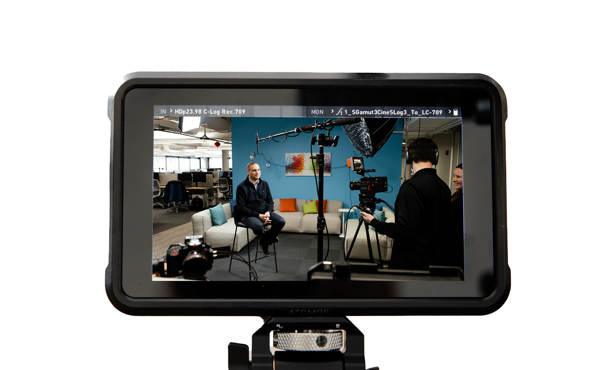 mm-device-monitor Film crew interviewing a person in a modern office